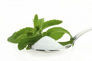 image of spoon with stevia and a stevia leaf